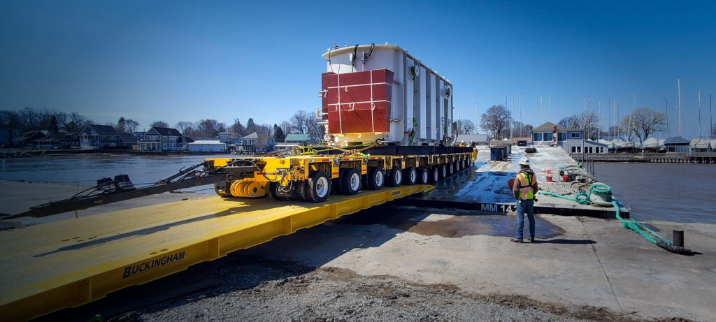 Buckingham Heavy Transport rolls a transformer from a barge