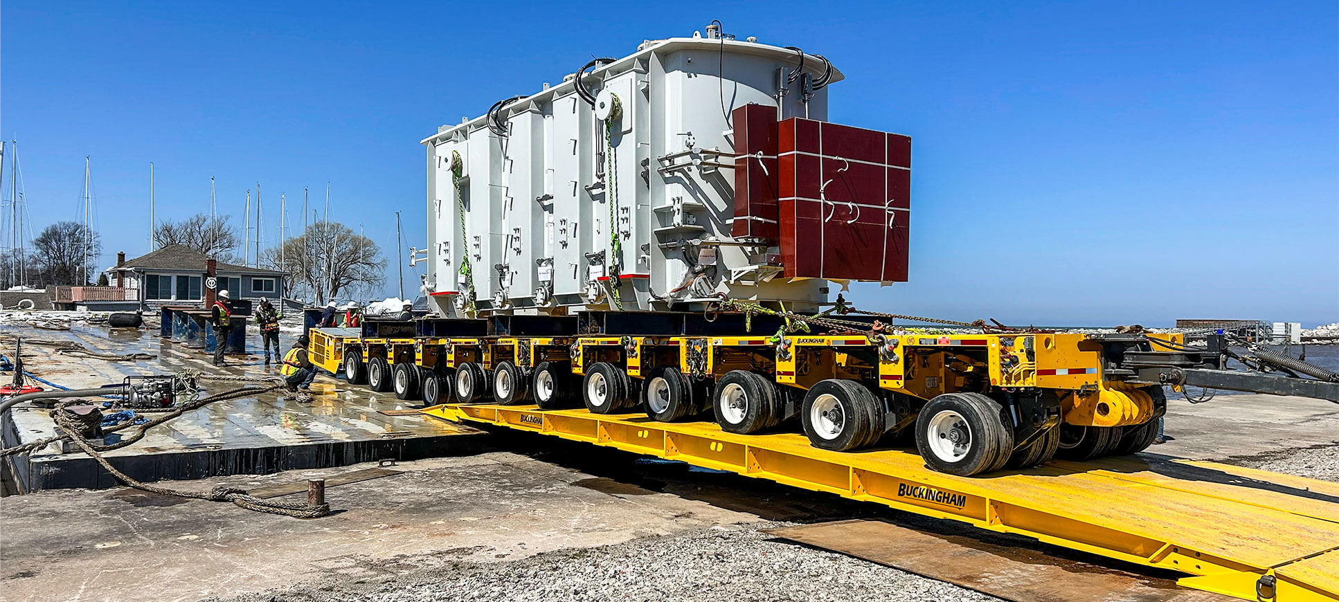 barge roll-off using Buckingham hinged-foot bridges